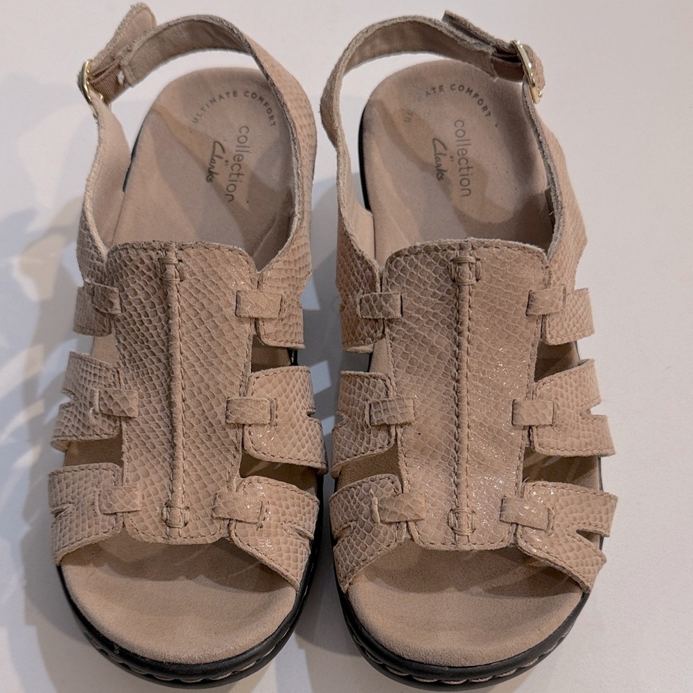 Clarks Lexi Marigold sandals in a beige/tan snakeskin-embossed leather finish.